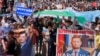 Citizens hold a placard "Give Us Back Furgal" during a rally in support of Khabarovsk Governor 